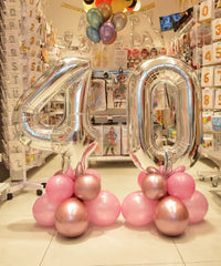 Bouquet ballon chiffre utilisé comme centre de table d’anniversaire