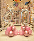 Bouquet ballon chiffre utilisé comme centre de table d’anniversaire