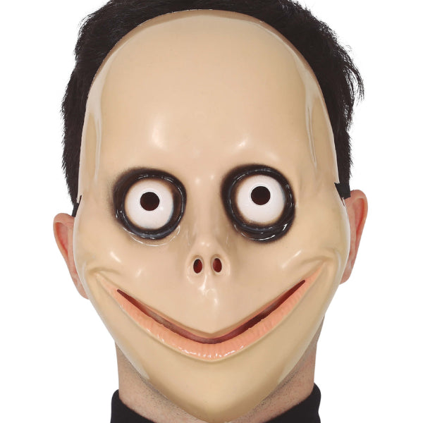 Masque Halloween sourire terrifiant avec yeux exorbités et expression glaçante.